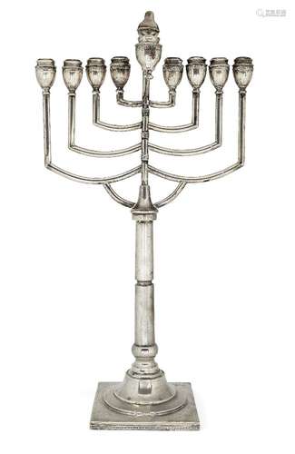 A large Art Deco menorah on a floral engraved square base, probably Polish c.1920, apparently