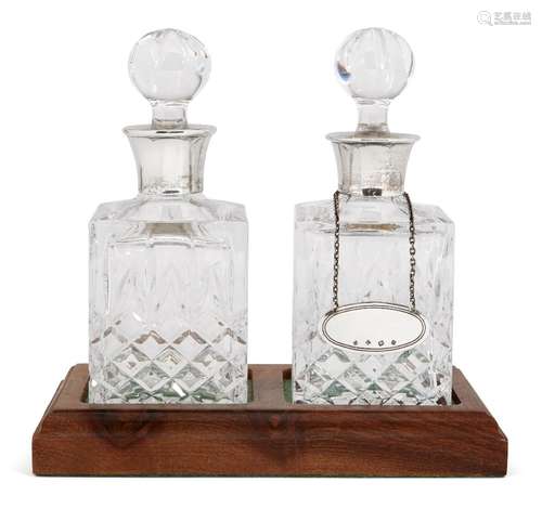 A set of three silver mounted decanters, all Birmingham, c.1986, Charles S Green & Co Ltd, on a