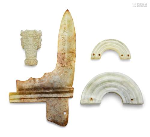 Four Chinese green jade archaistic carvings, Ming-Qing dynasty, comprising a halberd blade with