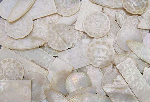 A collection of Chinese mother of pearl gaming counters, 19th century, engraved with birds or floral