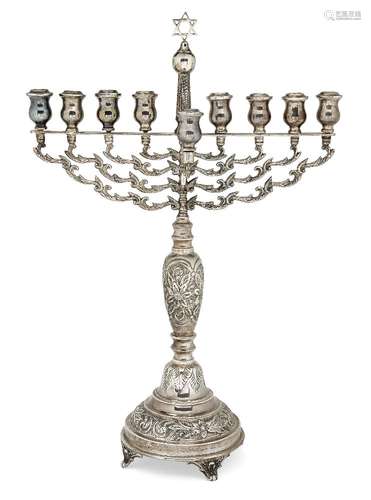 A large silver menorah by Joseph Zweig, London, c.1921, with foliate branches centred by a Star of