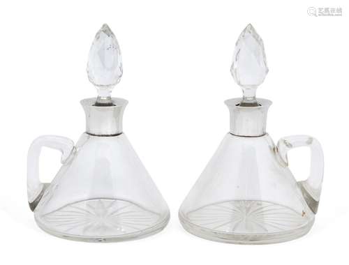 A matched pair of conical silver mounted glass decanters, one Birmingham, c.1907, John Charles