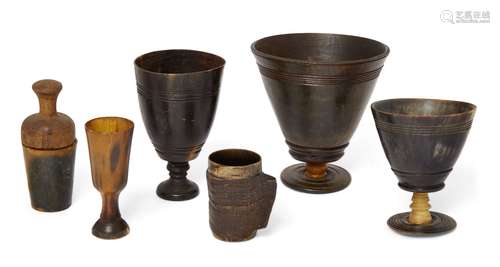 Three English or Scottish horn goblets, 19th century, of conical form and peg construction, the