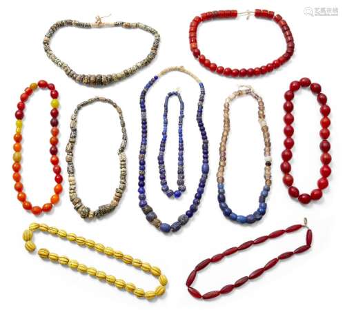 A collection of African hardstone and glass bead necklaces, early 20th century Provenance: The