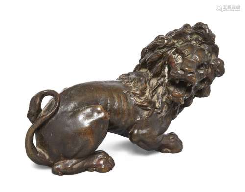 A bronze model of a lion, French or Italian, late 18th/early 19th century, depicted crouching on