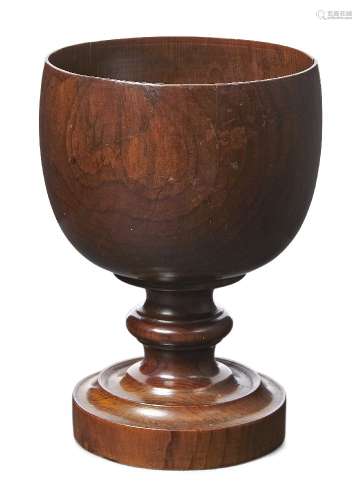 An English cedar goblet, late 18th century, the bowl raised on waisted stem and circular moulded