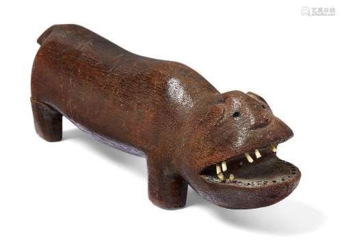 A Tanzanian hardwood carving of a hippo, early 20th century, carved standing four square with open