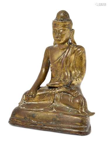 A Burmese polished bronze figure of Shakyamuni Buddha, 18th century, seated in dhyanasana, 13.3cm