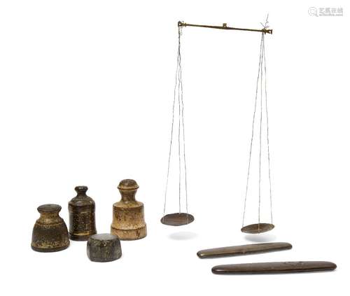 A group of bronze weights, three bell-shape examples, one octagonal example and two flat oblong