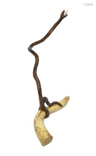 An Indian polychrome decorated carved wood model of a snake, 19th century, modelled with open