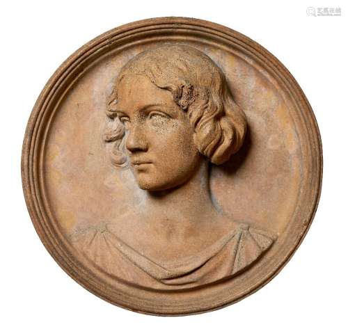 A Victorian terracotta portrait roundel, mid 19th century, modelled as a young lady, her gaze to