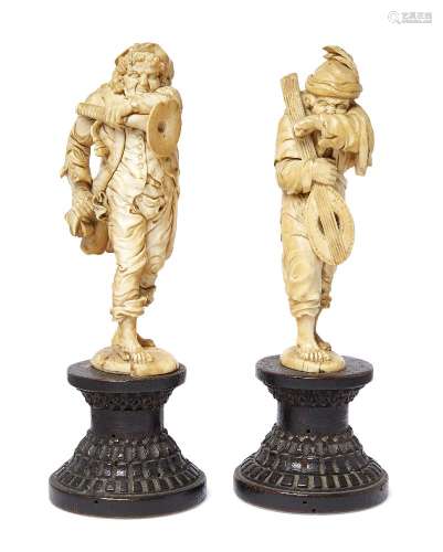 A pair of Austrian ivory models of itinerant musicians, circle of Simon Troger, 1683-1768, mid