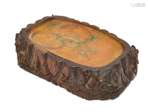 An unusual oak vide poche, early 20th century, carved with fairies in a woodland setting, inset with