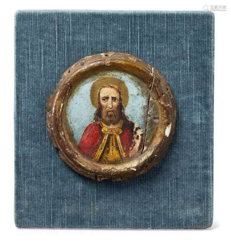 A Continental portrait roundel of a Saint, 18th/19th century, oil on wood, integral moulded gilt