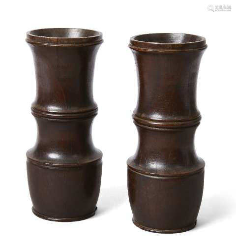 A pair of English turned lignum vitae mortars, late 17th/early 18th century, each of slender