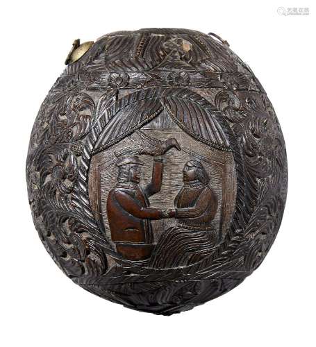 A carved coconut flask, possibly South American, 19th century, ornately carved overall with