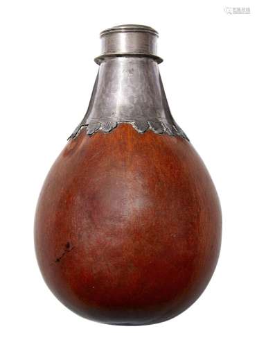 A white metal mounted gourd flask, probably South American, 18th/19th century, with stylised leaf