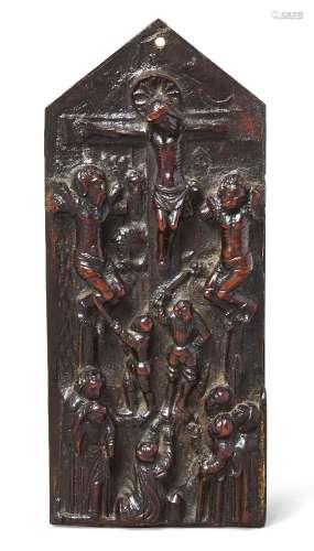 A Portugese colonial boxwood relief of The Crucifixion, 17th century, carved in deep relief with