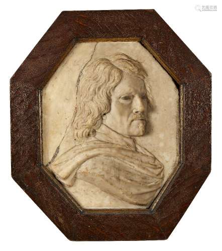An Anglo-Flemish marble portrait relief of a gentleman, late 17th century, with painted eyes, in