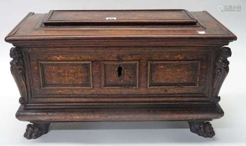 A 17th century Italian inlaid walnut cassone of small proportions with raised panel lid and triple