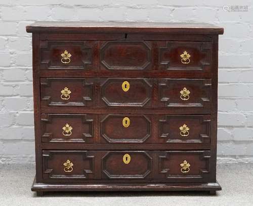 A Queen Anne oak chest, the lift top revealing a candle box and short drawer fitted interior,