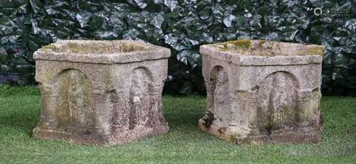 A pair of reconstituted stone pentagonal shaped garden planters, relief cast with figures in arches,