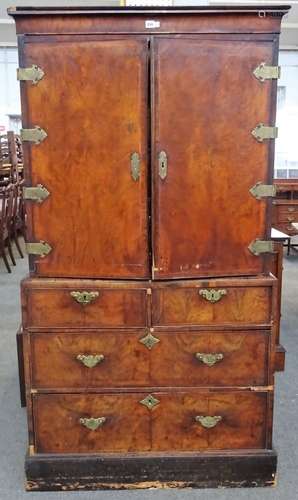 A George I and later featherbanded walnut cabinet on chest,