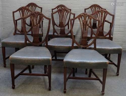 A set of eight George III mahogany shield back dining chairs,