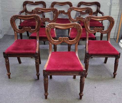 A set of eight William IV mahogany kidney back dining chairs, on tapering reeded supports,