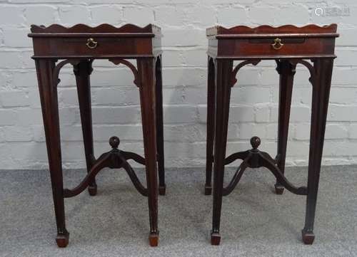 A pair of George III style mahogany tray top kettle stands, each with candle slide,