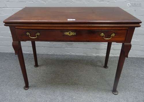 A George II mahogany rectangular foldover tea table, with single frieze drawer on club supports,