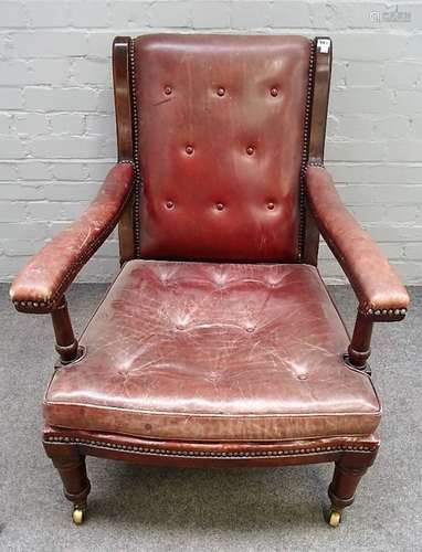 Maple & Co, a mahogany framed open armchair, in rouge leather upholstery on turned supports,