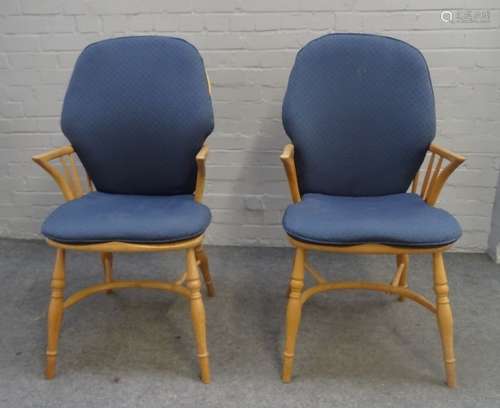 Ercol; a pair of ash and elm stick back Windsor chairs, on turned supports,