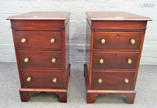 A pair of 18th century style mahogany three drawer pedestals, on bracket feet,