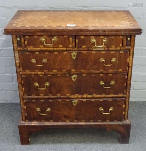 An 18th century chevron banded figured walnut batchelor's chest,