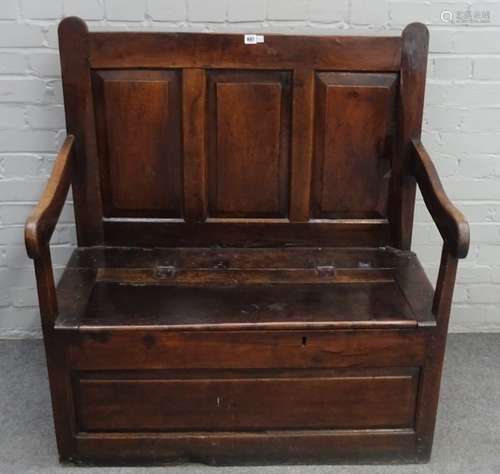 An 18th century oak box seat open arm settle, with triple panel back, 100cm wide x 109cm high.