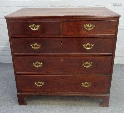 An 18th century oak chest of two short over three long graduated drawers, on bracket feet,