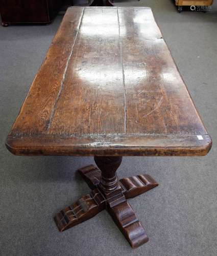 A Tudor style oak refectory table, the cleated planked rectangular top,