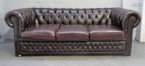 A 20th century brown leather upholstered buttonback Chesterfield sofa on block feet,