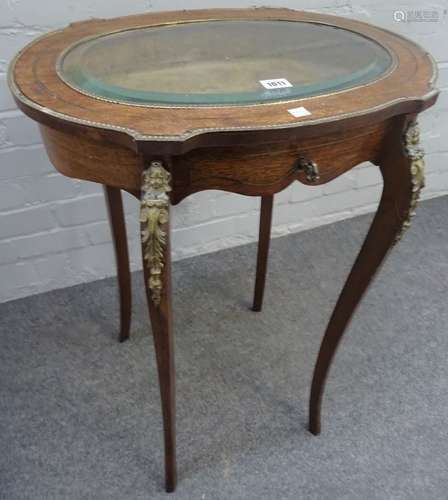 A late 19th century French gilt metal mounted mahogany oval bijouterie table,