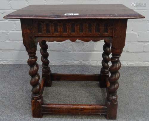 A 17th century and later oak joint stool, with carved frieze on barley twist supports,