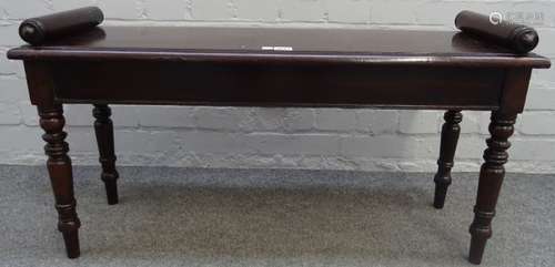 A 19th century mahogany window seat, with turned end stops and supports, 95cm wide x 48cm high.