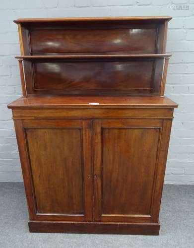 A Regency mahogany chiffonier, the two tier shelf back over pair of cupboards on plinth base,