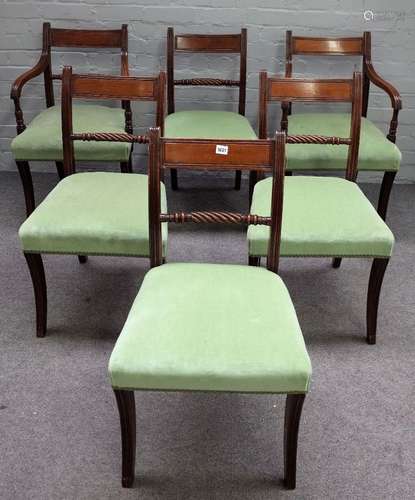 A set of six George IV mahogany dining chairs, with rope twist waist rail and sabre supports,