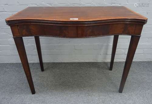 A George III satinwood banded mahogany serpentine card table, with dished gaming wells,