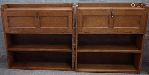 A near pair of oak Arts & Crafts floor standing bookcases,