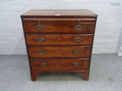 A George III mahogany chest, the brushing slide over four long graduated drawers, on bracket feet,