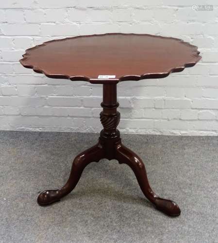 An 18th century mahogany occasional table, the snap pie-crust top on spiral column and tripod base,