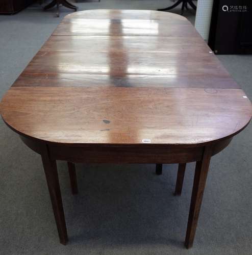 A George III mahogany triple 'D' end extending dining table,