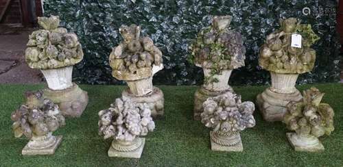 A set of four Vicenza stone finials moulded as flowers and fruit,